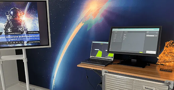 Showroom Bischofszell: Collab Trolley mit Laptop und Monitor vor einem Weltraum-Wandbild